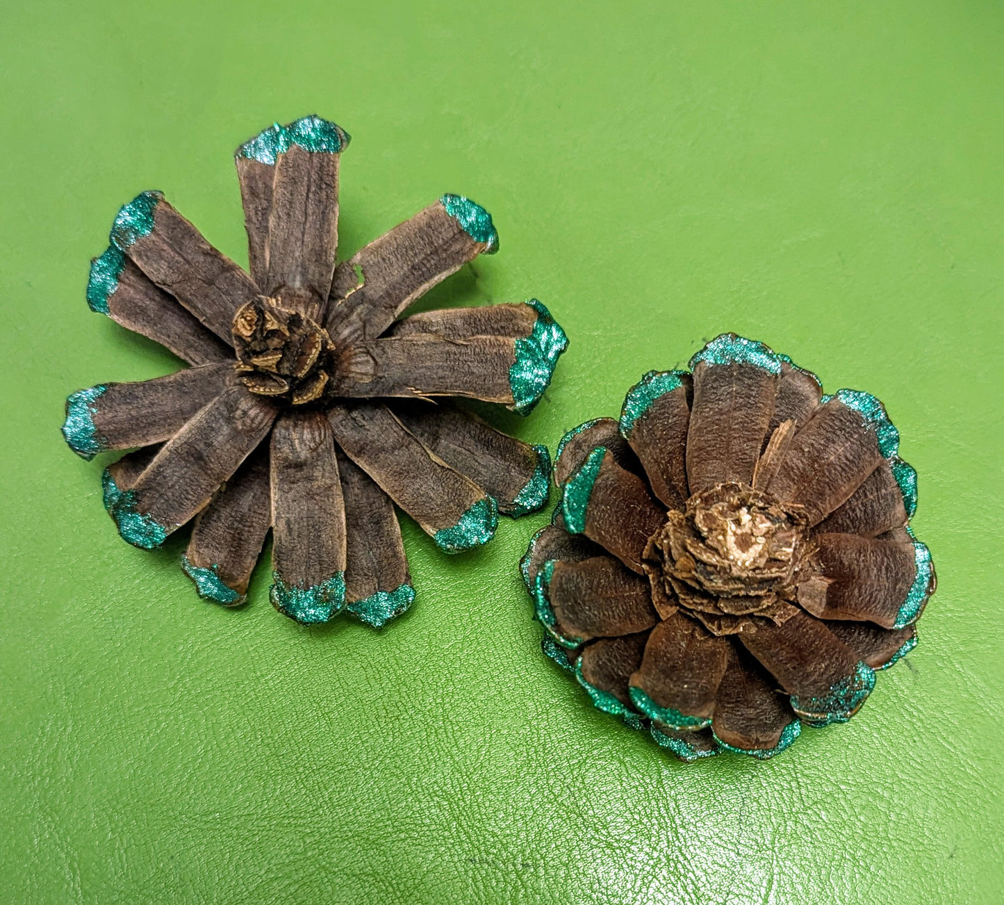 Custom wreath with glitter painted flower pinecones