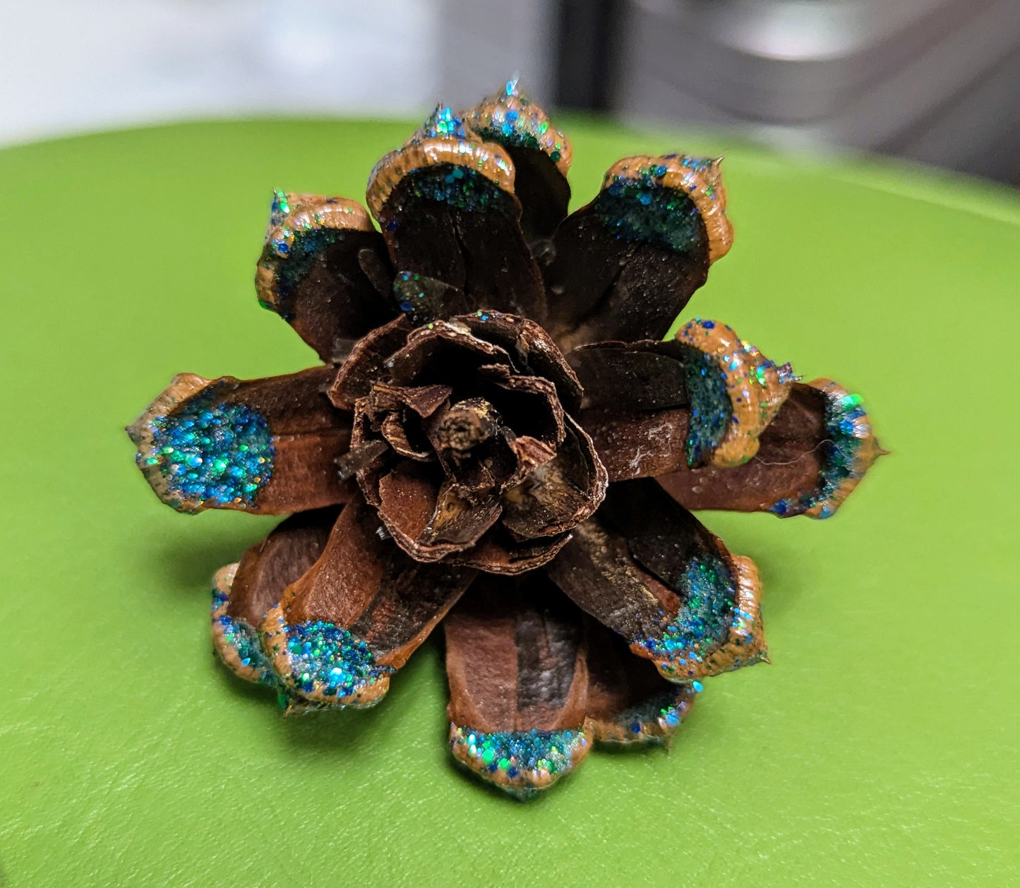 Custom wreath with glitter painted flower pinecones