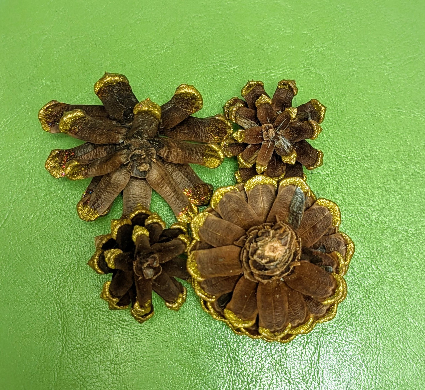 Custom wreath with glitter painted flower pinecones