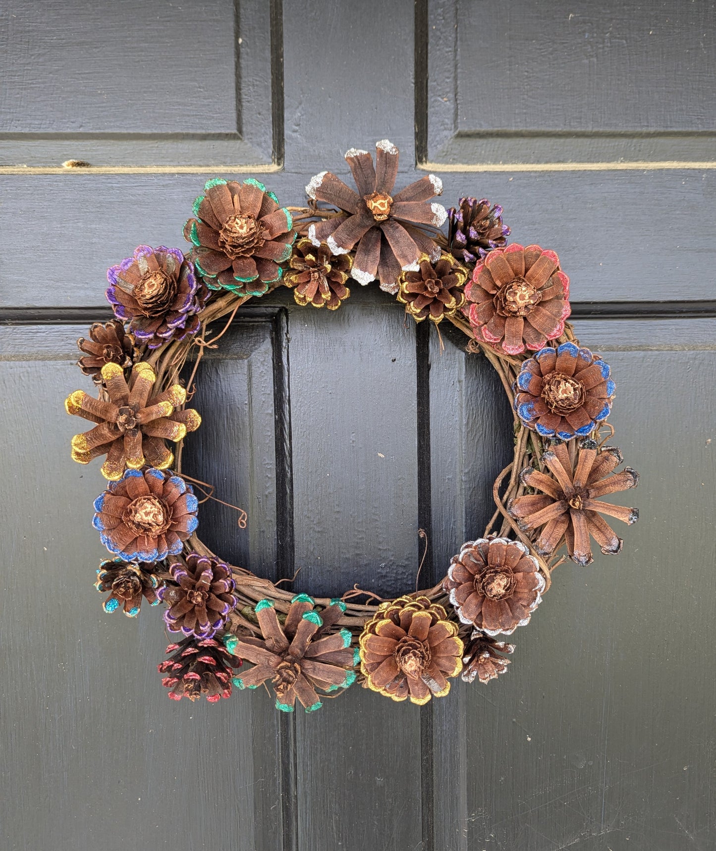 Custom wreath with glitter painted flower pinecones