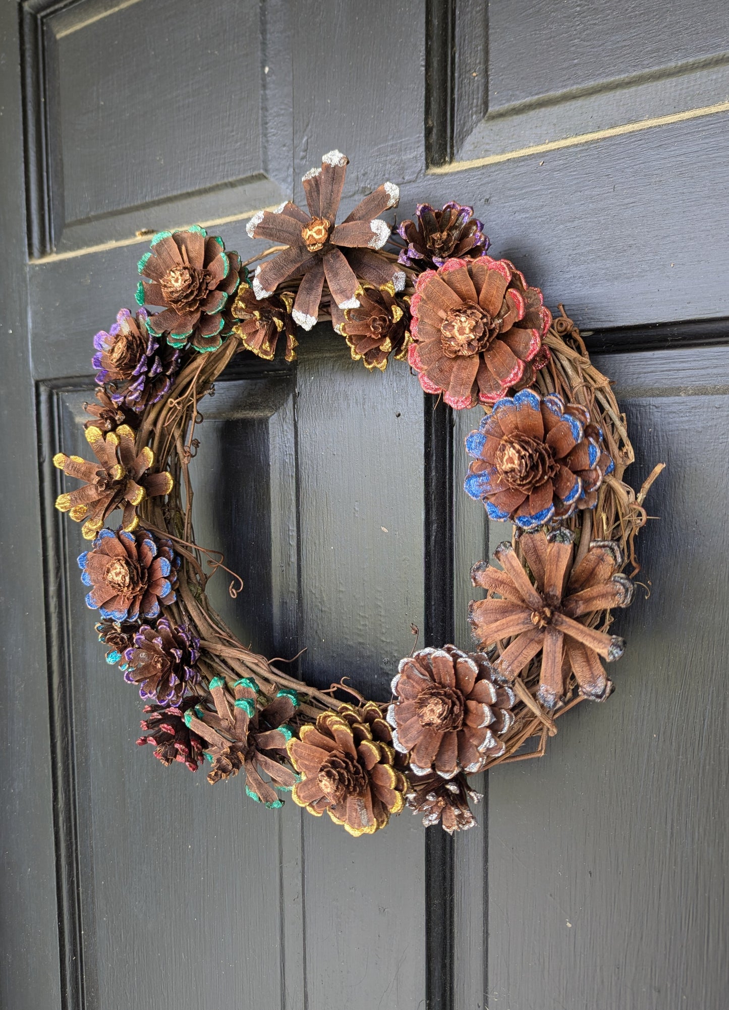 Custom wreath with glitter painted flower pinecones